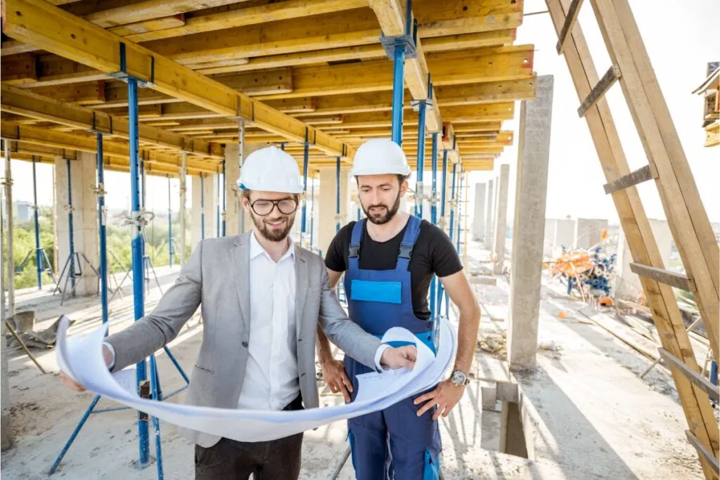 client consulting with the deck builder on site 